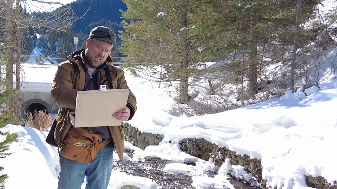 Picture ofauthor being curious with art outdoors